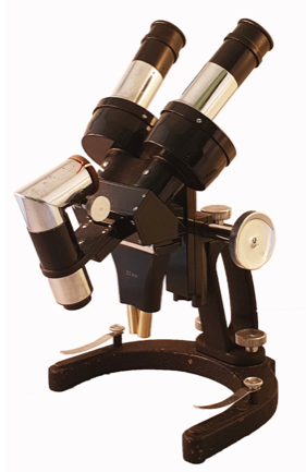 A black and silver microscope
Description automatically generated