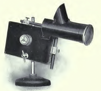 A picture containing sewing machine, black, appliance
Description automatically generated