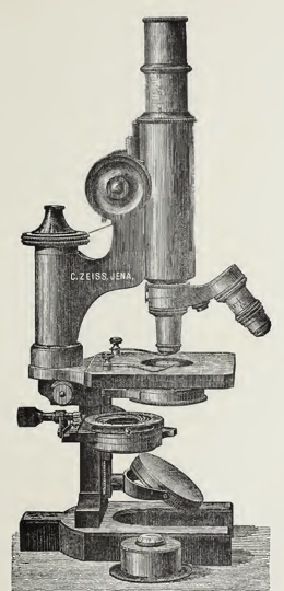 A picture containing wall, indoor, old, microscope
Description automatically generated