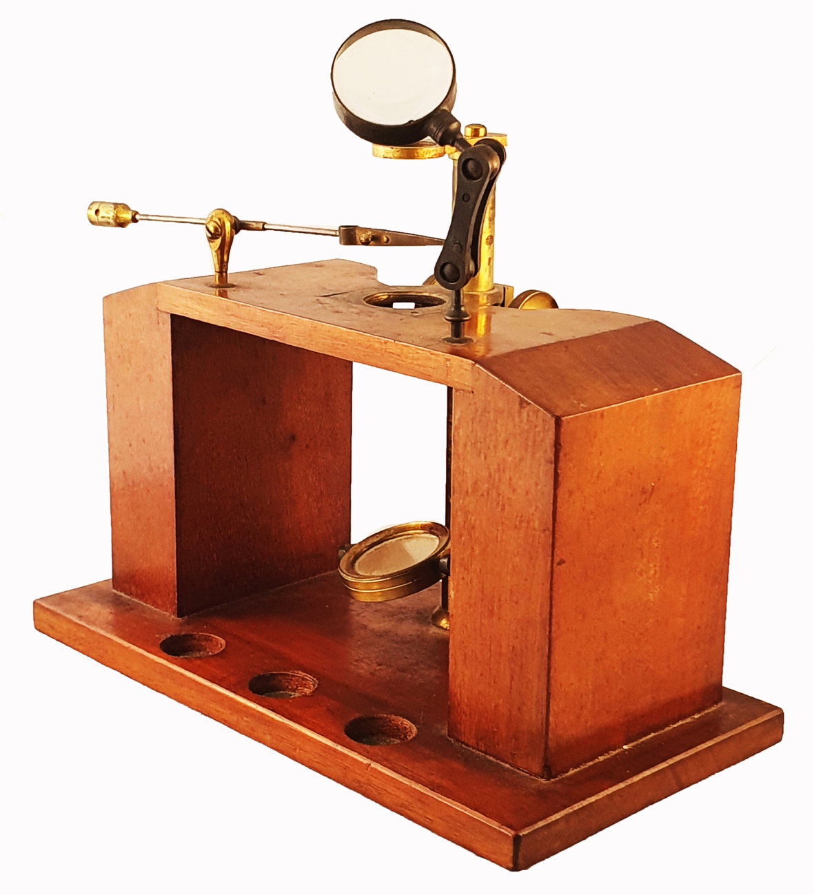A wooden device with a magnifying glassDescription automatically ...