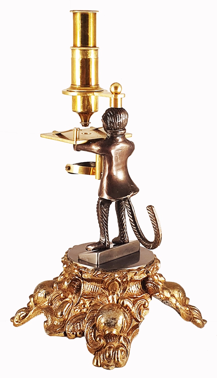 Microscope Statue A statue of a person holding a trayDescription automatically generated