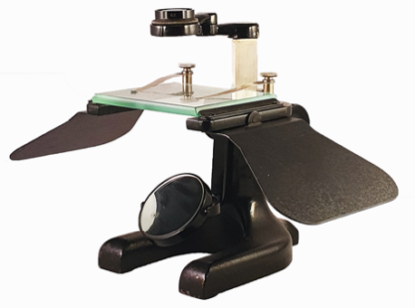 A picture containing sitting, table, desk, person
Description automatically generated