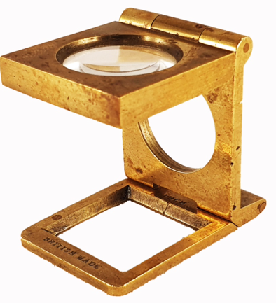 A gold metal magnifying glass
Description automatically generated