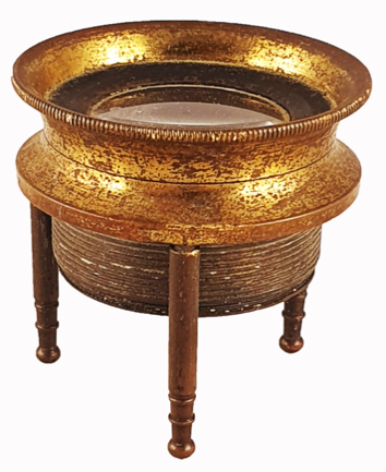 A gold and black metal bowl
Description automatically generated with medium confidence