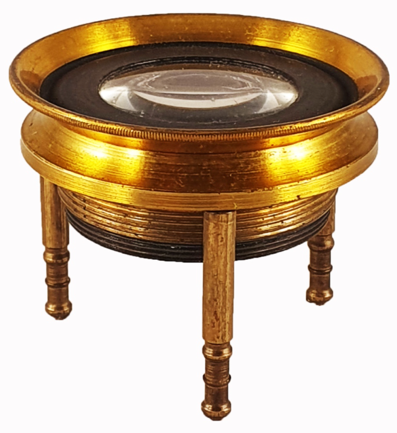 A gold and black circular object
Description automatically generated