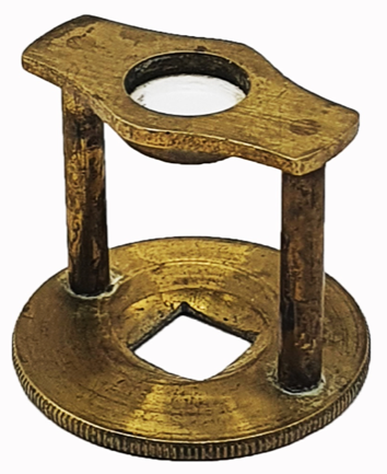 A gold object with holes
Description automatically generated