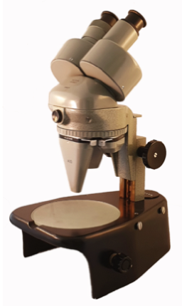 A close-up of a microscope
Description automatically generated